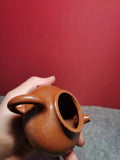 The purple clay teapot made of red purple clay has a capacity of 130cc